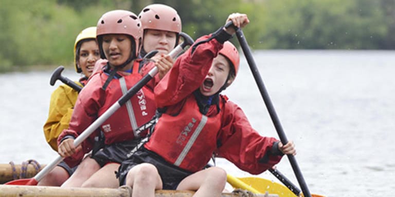 Children canoeing with YHA