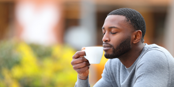 Man drinking cup of tea